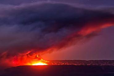 Dragon Bravo Wildfire burning on Grand Canyon North Rim viewed from Antelope Pass on Echo Cliffs off of US89 at night under moonlight.