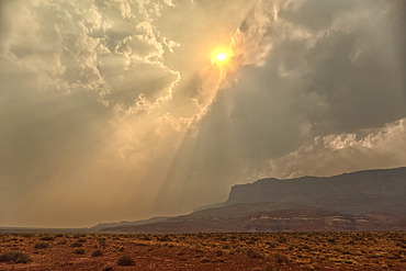Sun shining thru dense smoke from the Dragon Bravo Wildfire enshrouding Vermilion Cliffs National Monument Arizona. Viewed from US89A.