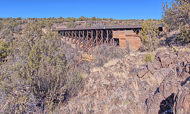 The historic Bainbridge Steel Dam near Ash Fork Arizona in the Kaibab National Forest. It was originally constructed in the late 1800s and is now a historic landmark that is open to the public.