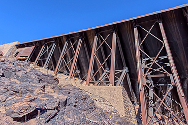 View from below the historic Bainbridge Steel Dam near Ash Fork Arizona in the Kaibab National Forest. It was originally constructed in the late 1800s and is now a historic landmark that is open to the public.