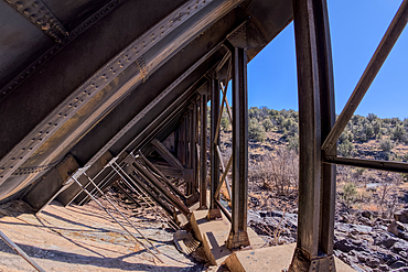 View from inside the steel framework of the historic Bainbridge Steel Dam near Ash Fork Arizona in the Kaibab National Forest. It was originally constructed in the late 1800s and is now a historic landmark that is open to the public.