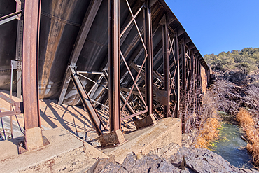 Closeup view of the steel framework of the historic Bainbridge Steel Dam near Ash Fork Arizona in the Kaibab National Forest. It was originally constructed in the late 1800s and is now a historic landmark that is open to the public.