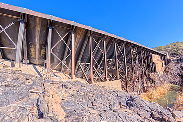 Closeup view of the steel framework of the historic Bainbridge Steel Dam near Ash Fork Arizona in the Kaibab National Forest. It was originally constructed in the late 1800s and is now a historic landmark that is open to the public.