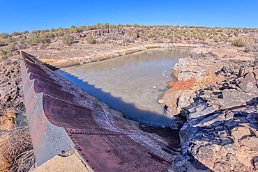 Overhead view of the historic Bainbridge Steel Dam near Ash Fork Arizona in the Kaibab National Forest. It was originally constructed in the late 1800s and is now a historic landmark that is open to the public.