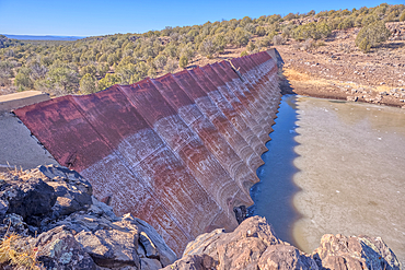 Top face view of the historic Bainbridge Steel Dam near Ash Fork Arizona in the Kaibab National Forest. It was originally constructed in the late 1800s and is now a historic landmark that is open to the public.