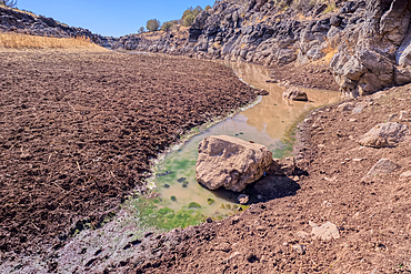 The eastern edge of the lake created by the historic Bainbridge Steel Dam near Ash Fork Arizona in the Kaibab National Forest. It was originally constructed in the late 1800s and is now a historic landmark that is open to the public.