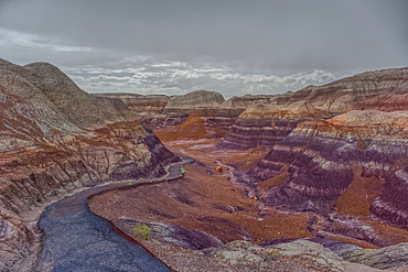 A paved trail leading below Blue Mesa in Petrified Forest National Park Arizona.
