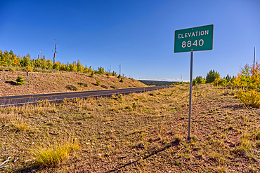 A sign marking 8840 foot elevation on the Kaibab Plateau in northern Arizona. This is the highest point on the plateau.