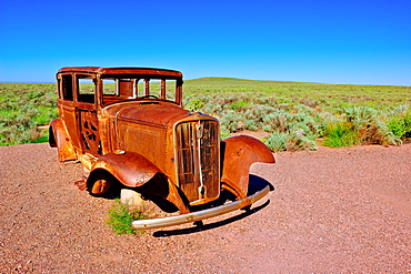 The old rusting steel shell of a Model-T mounted on concrete pillars along the old historic Route 66, Arizona, United States of America, North America