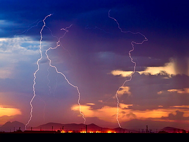 Three bolts of lightning striking near the Palo Verde Nuclear Station in Wintersburg Arizona during the 2012 Monsoon season, Arizona, United States of America, North America