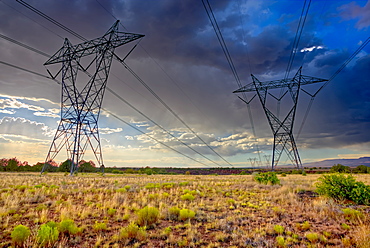 High voltage power lines stretching across Hell Canyon east of Paulden, located in the Prescott National Forest, Arizona, United States of America, North America