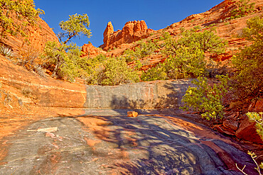 A dry waterfall sandstone ledge on a trail to Steamboat Rock, Coconino National Forest, Sedona, Arizona, United States of America, North America