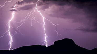 A panorama photo of lightning striking the slopes of Woolsey Peak during the 2012 Arizona Monsoon season, Arizona, United States of America, North America