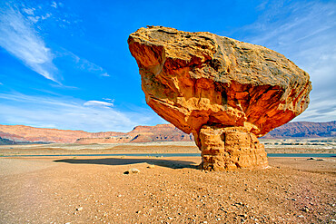 Balanced boulder at the base of Vermilion Cliffs in Glen Canyon Recreation Area, Arizona, United States of America, North America