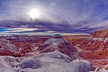 A ridge of purple bentonite clay jutting out into Jasper Forest at Petrified Forest National Park Arizona.