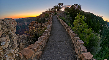 The paved pathway between Bright Angel Point and the visitor center at Grand Canyon North Rim at twilight, Grand Canyon National Park, UNESCO World Heritage Site, Arizona, United States of America, North America