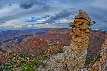 View of Grand Canyon and a rock spire from within a gap between a stack of balanced boulders at Grandview Point, Grand Canyon National Park, UNESCO World Heritage Site, Arizona, United States of America, North America