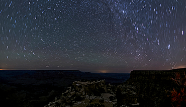 The swirl of stars in the night sky over Grand Canyon South Rim viewed from Moran Point, Grand Canyon National Park, UNESCO World Heritage Site, Arizona, United States of America, North America