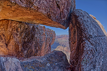 Grand Canyon viewed through a rock cave below Lipan Point on the South Rim, Grand Canyon National Park, UNESCO World Heritage Site, Arizona, United States of America, North America