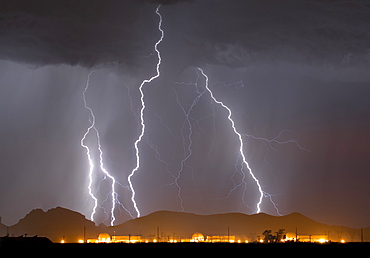 A large lightning storm behind a nuclear power plant in western Arizona during the 2014 Monsoon season, Arizona, United States of America, North America