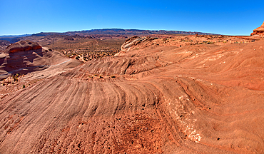 A wavy sandstone hill, a fossilized sand dune, at Ferry Swale in the Glen Canyon Recreation Area near Page, Arizona, United States of America, North America