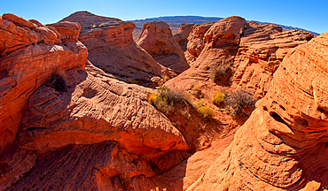 A narrow canyon running between several rock islands at Ferry Swale in the Glen Canyon Recreation Area near Page, Arizona, United States of America, North America