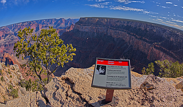 A sign in different languages warning of a dangerous cliff at the West Vista of the Trailview Overlook along the Hermit Road rim trail, Grand Canyon, UNESCO World Heritage Site, Arizona, United States of America, North America