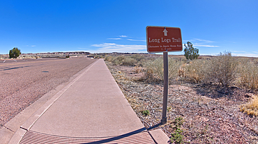 A sign along the main road pointing the way to the Long Logs Trail, and Agate House, Petrified Forest National Park, Arizona, United States of America, North America