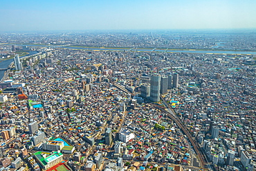 Aerial view of Tokyo city skyline with Asahi Beer Hall, Asahi Flame, Sumida River Bridges and Asakusa area, Tokyo, Japan, Asia