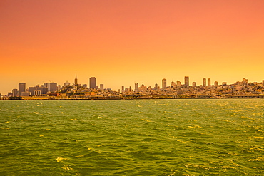 Sea view from boat to Alcatraz at sunset of San Francisco Financial District skyline, San Francisco, California, United States of America, North America