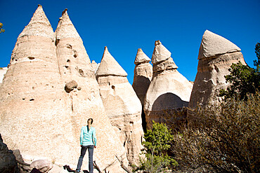 Woman admiring sandstone towers in Kasha-Katuwe Tent Rocks National Monument, New Mexico, United States of America, North America