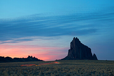 Light trails leading to Shiprock in Farmington at dusk, New Mexico, United States of America, North America