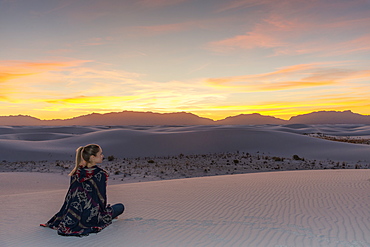 Woman watching the sunset in White Sands National Park, New Mexico, United States of America, North America