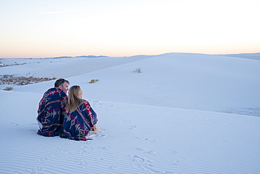 A couple enjoy White Sands National Park at sunset, New Mexico, United States of America, North America