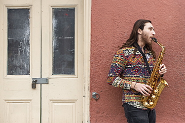 Saxophone player on a Bourbon Street corner in the French Quarter of New Orleans, Louisiana, United States of America, North America