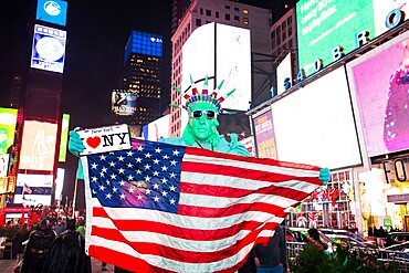 Statue of Liberty impersonators posing with tourists for tips at Times Square, Manhattan, New York City, New York, United States of America, North America