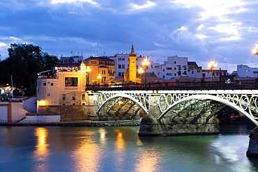 The Triana Bridge (Puente de Triana) (Puente de Isabelle II) at twilight, Seville, Andalucia Spain, Europe