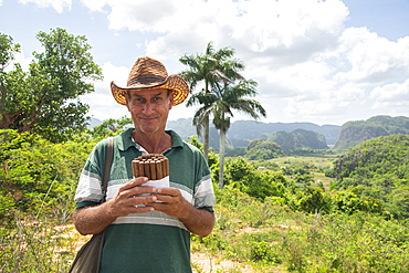 Local man selling Cuban cigars in Vinales, UNESCO World Heritage Site, Cuba, West Indies, Caribbean, Central America