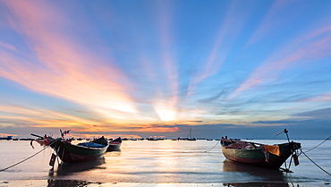 Sunset from Front beach, Vung Tau with pink clouds and small fishing boats in the foreground, Vung Tau, Vietnam, Indochina, Southeast Asia, Asia