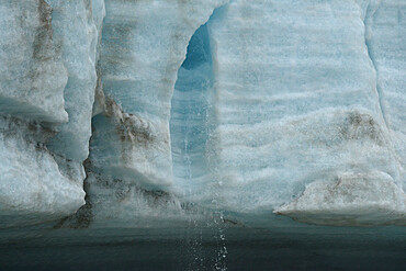 Melt water flowing from glacier face, Nunavut and Northwest Territories, Canada, North America