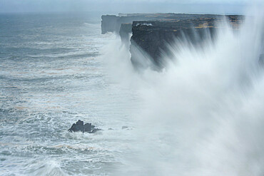 Saxholsbjarg cliff being hit by large waves, Iceland, Polar Regions