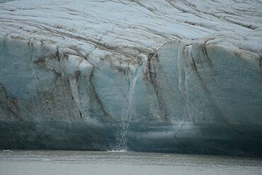 Melt water flowing from glacier face, Nunavut and Northwest Territories, Canada, North America