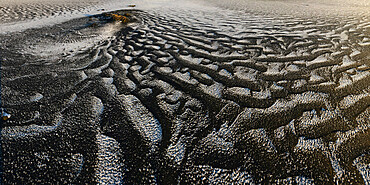 Windswept black sand with snow on top, Iceland, Polar Regions