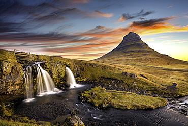 Sunrise at Kirkjufell Mountain overlooking a small waterfall, Iceland, Polar Regions