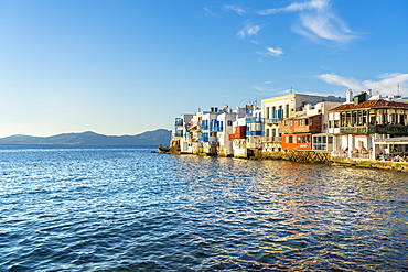 Mykonos Town at sunset with mountains in background, Mykonos, Cyclades, Greek Islands, Greece, Europe