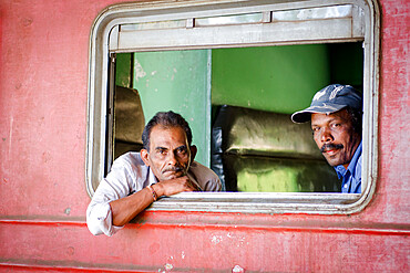 Two men on a train, Ella train station, Sri Lanka, Asia