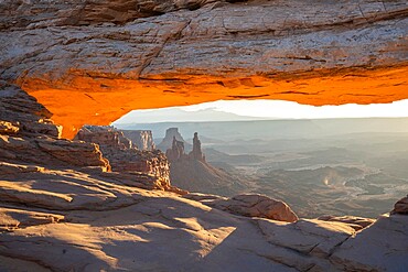 Close up view of canyon through Mesa Arch with glowing arch, Canyonlands National Park, Utah, United States of America, North America