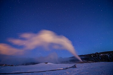 Old Faithful geyser under a starry sky, Yellowstone National Park, UNESCO World Heritage Site, Wyoming, United States of America, North America