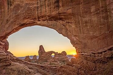 Sunset and Turret Arch view through Windows Arch, Arches National Park, Utah, United States of America, North America