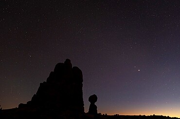 Silhouette of Balanced Rock at dusk, Arches National Park, Utah, United States of America, North America